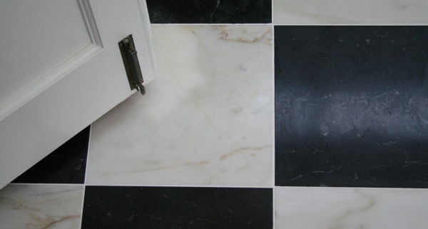 Honed black and white marble floor tiles