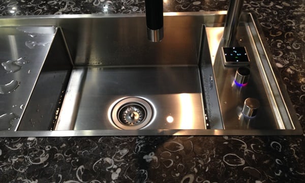 Dornbracht sink, tap with Italian Occhio di Pavone black and white marble