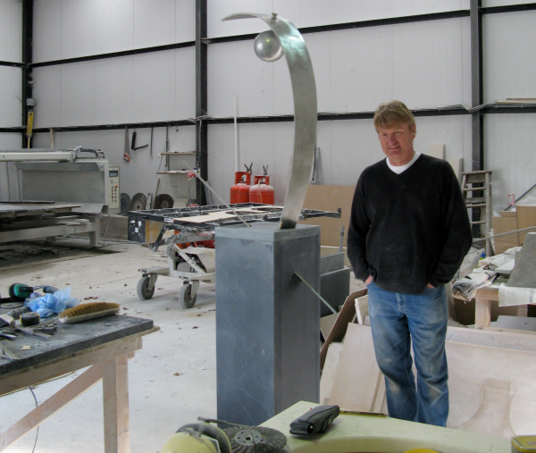 Steve inspects slate plinth in workshop resized 600
