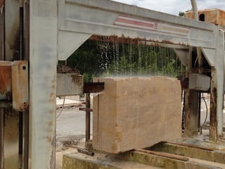 Cutting a block of French limestone into slabs